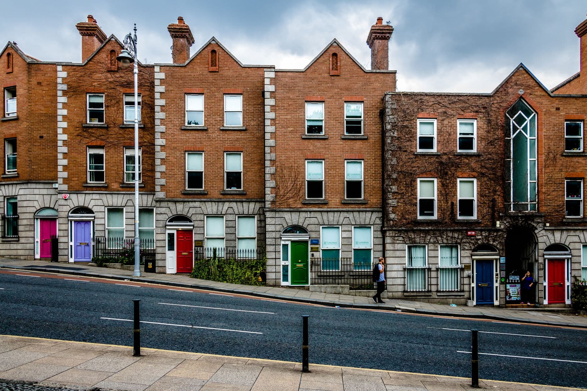 Colorful Georgian-style buildings line a street in Dublin, Ireland.